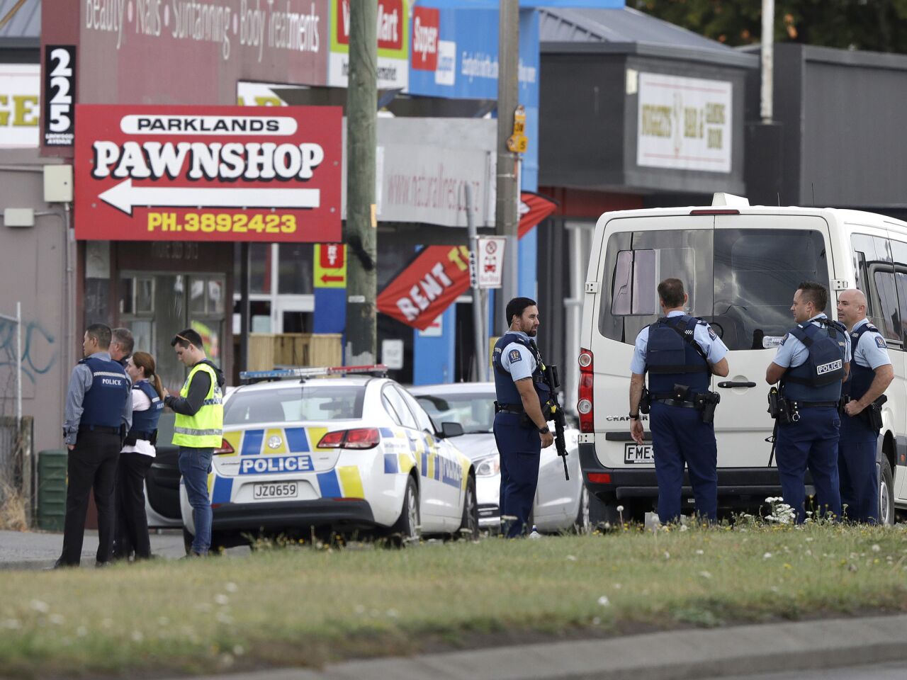 Police stand outside a mosque in Christchurch, New Zealand. Multiple people were killed during shootings at two mosques full of people attending Friday prayers.