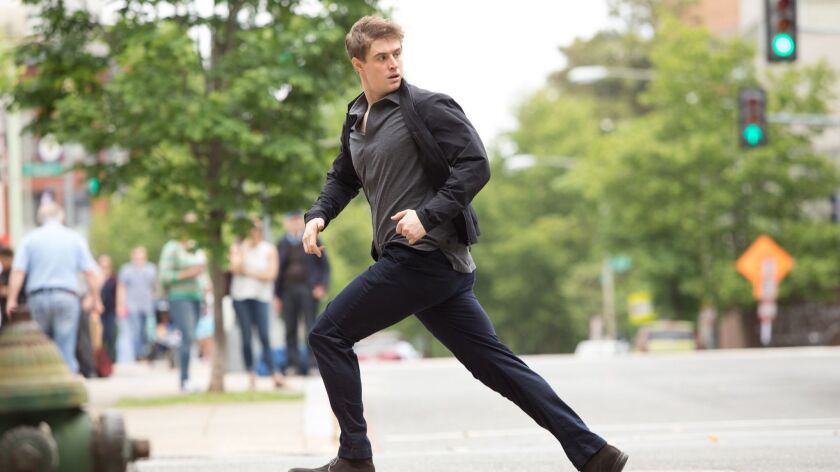 Max Irons plays a CIA analyst on the run from mysterious forces in the Audience Network series "Condor."