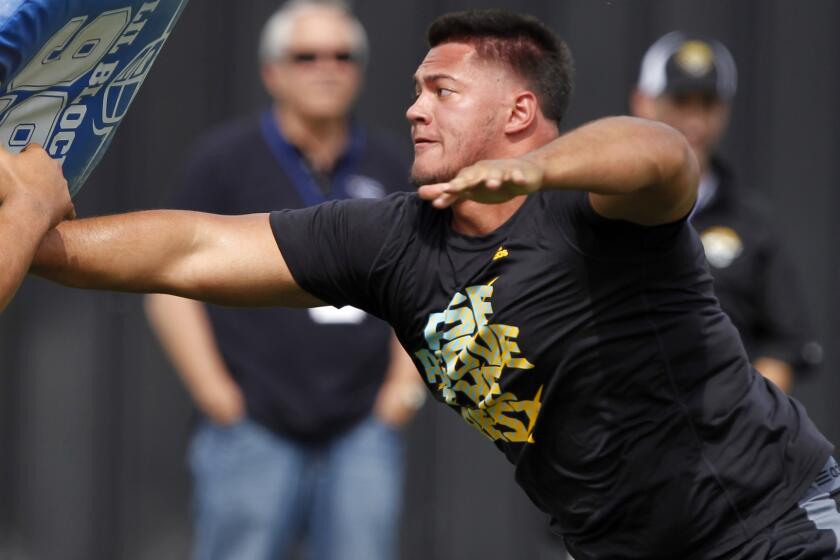Offensive lineman Xavier Su'a-Filo works out during UCLA's pro day at Spaulding Field in March. Su'a-Filo could end up be a first-round selection in the NFL draft.