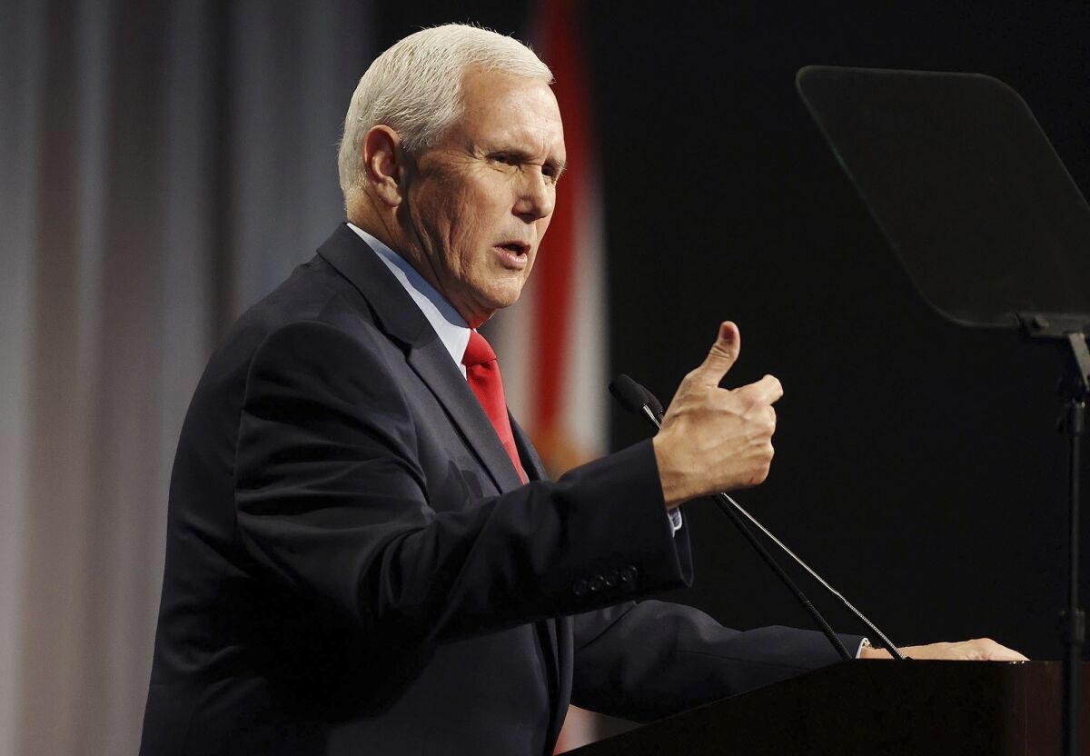 Former Vice President Mike Pence speaks at the Florida chapter of the Federalist Society's annual meeting.