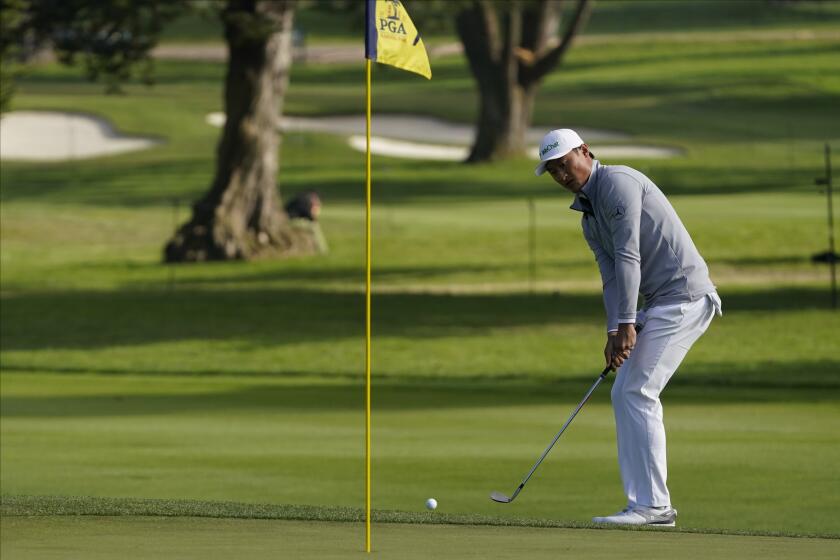 Haotong Li of China, chips to the green on the seventh hole during the second round of the PGA Championship.