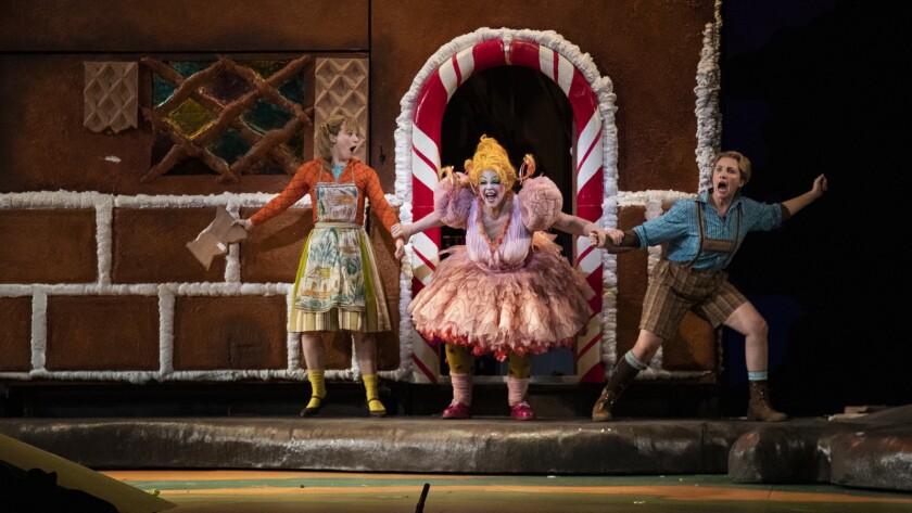 Hansel and Gretel (Sasha Cooke and Liv Redpath) are grabbed by the wicked witch, played by Susan Graham, in LA Opera's "Hansel and Gretel" at the Dorothy Chandler Pavilion.