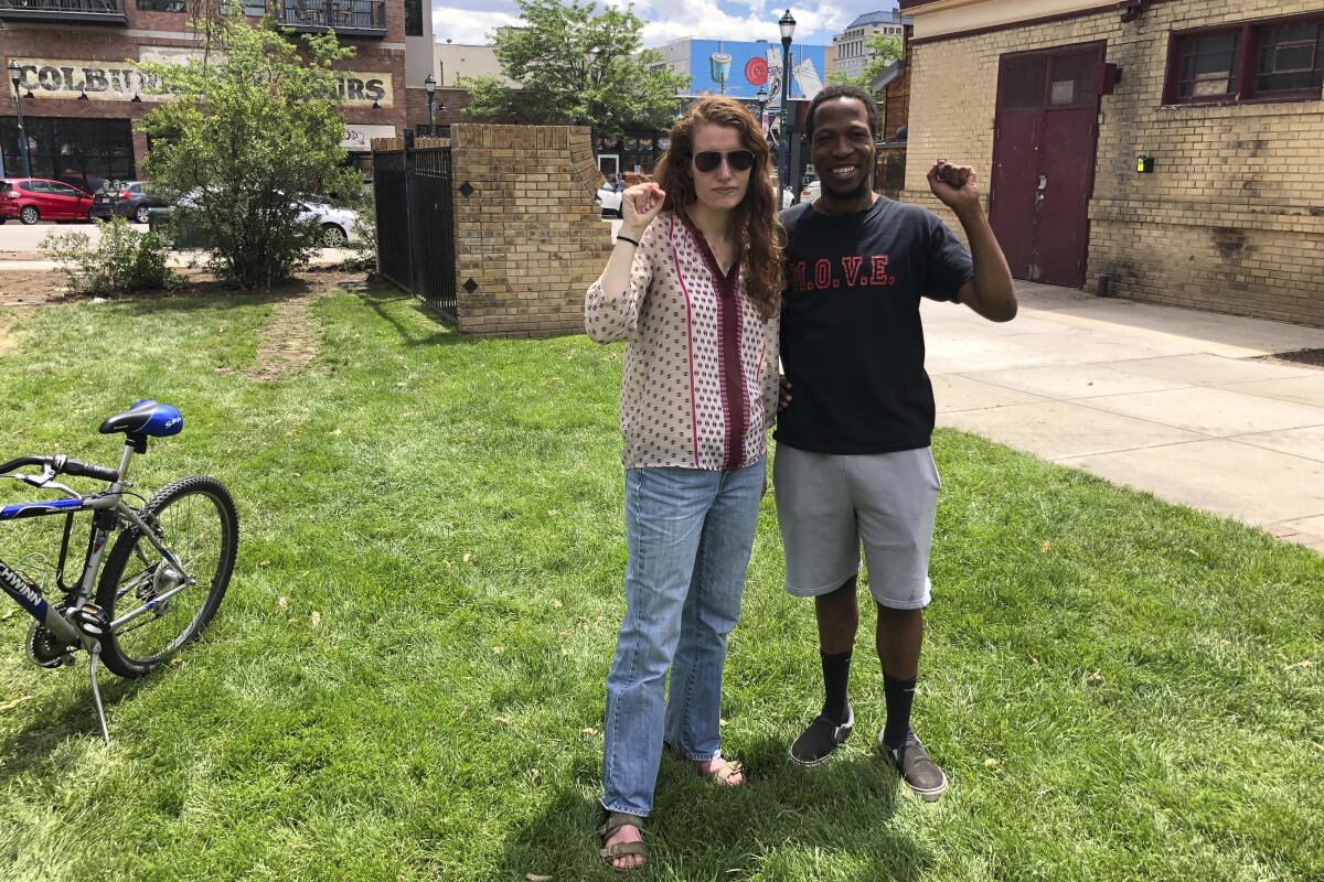 Maryah Lauer and Chauncy Johnson pose for a photo in Colorado Springs, Colo., shortly after interrupting a rally