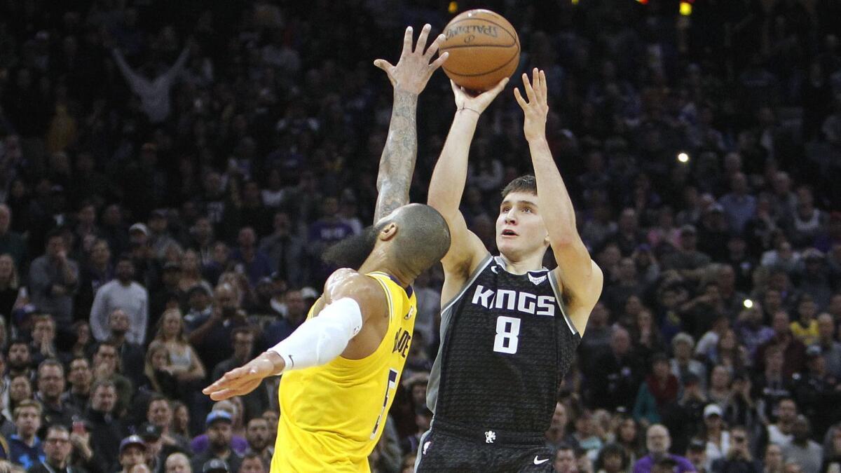 Sacramento Kings guard Bogdan Bogdanovic (8) hits a three-point shot over Lakers center Tyson Chandler (5) at the buzzer.