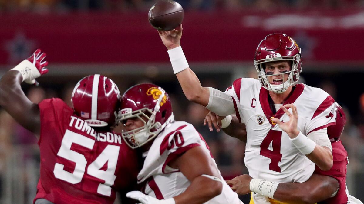 USC quarterback Max Browne is pressured as he attempts a pass against Alabama in the first half Saturday.