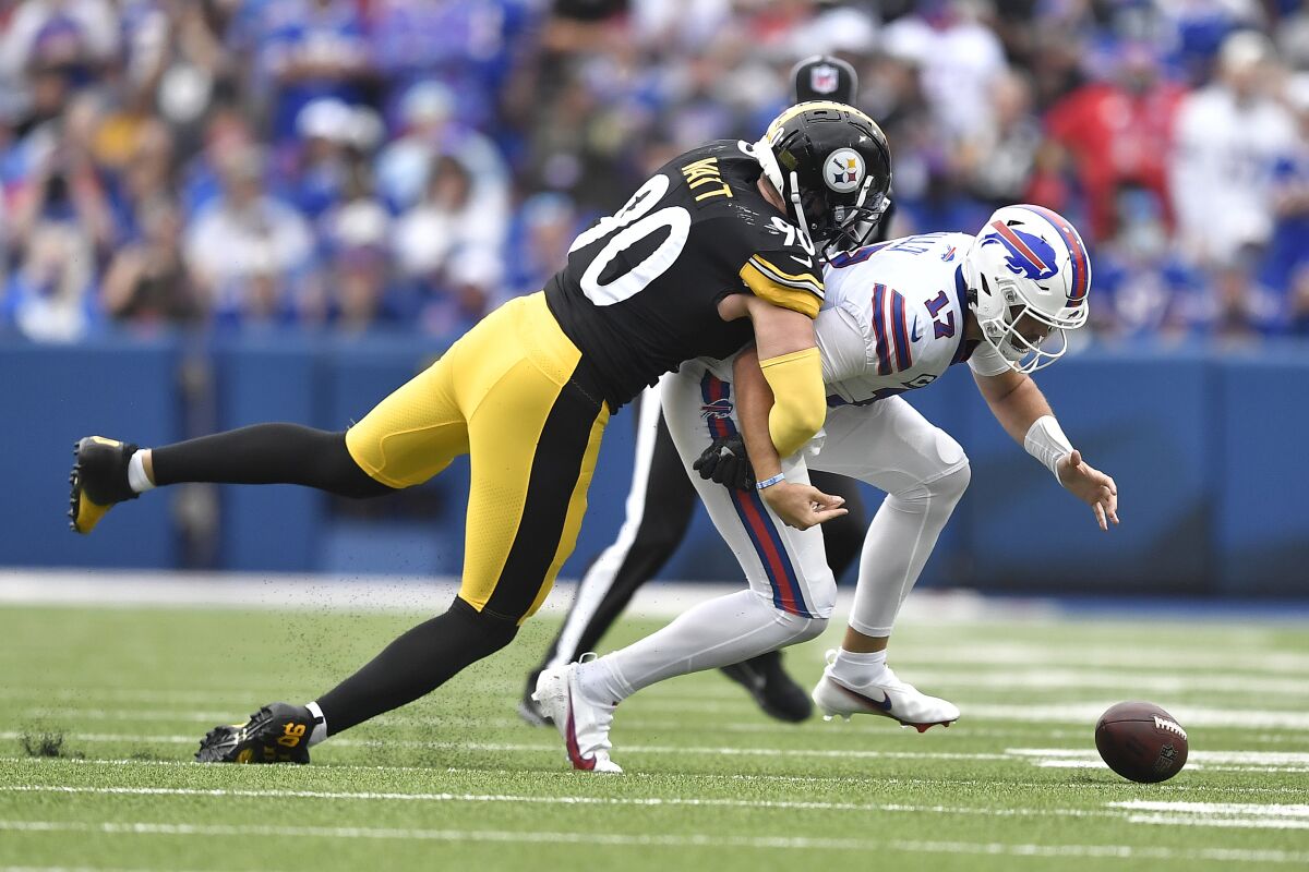 Buffalo Bills quarterback Josh Allen (17) fumbles as he is tackled by Pittsburgh Steelers outside linebacker T.J. Watt during the first half of an NFL football game in Orchard Park, N.Y., Sunday, Sept. 12, 2021. The Steelers recovered the ball. (AP Photo/Adrian Kraus)
