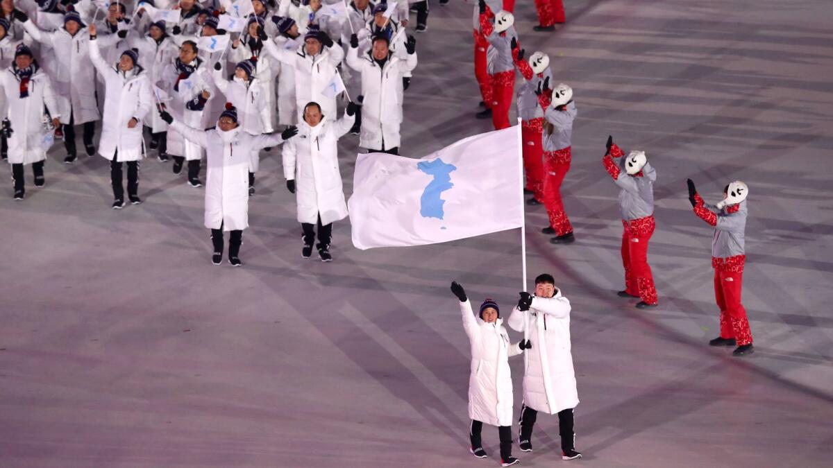 The North Korean and South Korean Olympic teams enter together under the Korean unification flag during the opening ceremony of the 2018 Winter Olympic Games in Pyeongchang, South Korea, on Feb. 9, 2018.