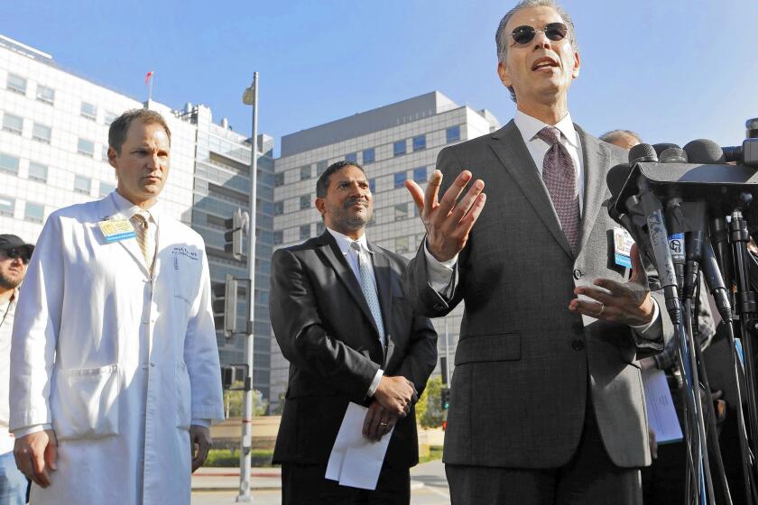 UCLA defended its new cleaning protocol and said no new infections have occurred since making the change. Above, Dr. David Feinberg, right, president of the UCLA Health System, takes questions during a press conference last week. With him are Dr. Zachary Rubin, left, UCLA's medical director of clinical epidemiology and infection prevention, and Robert Cherry, chief medical and quality officer at UCLA Health System