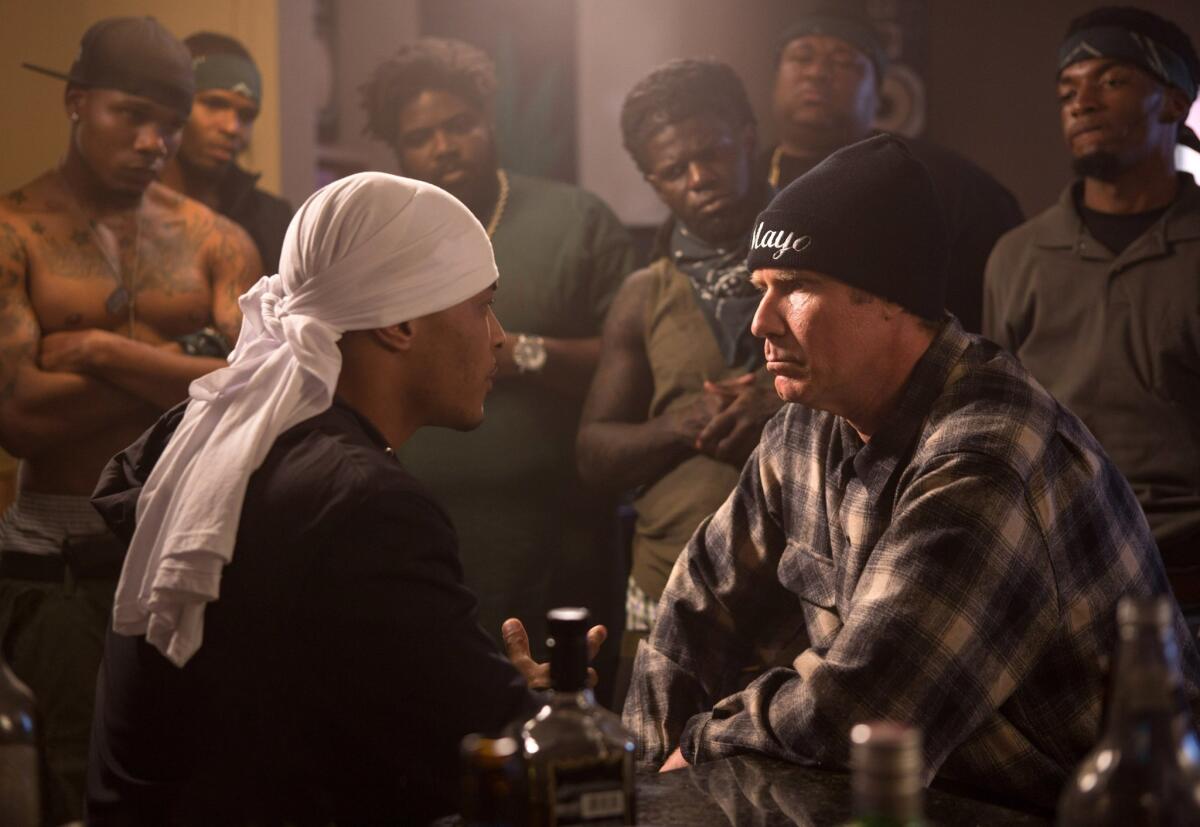 Will Ferrell, right, and T.I. in a scene from "Get Hard."