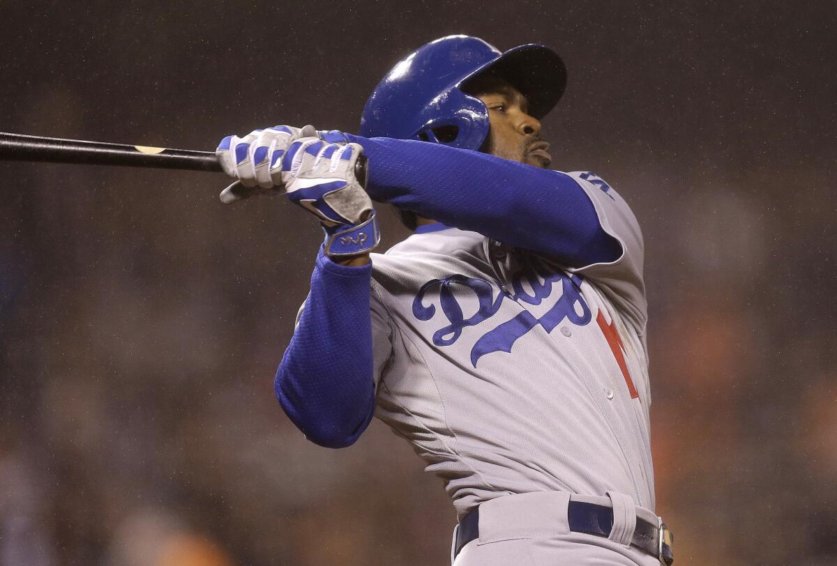 Dodgers short stop Jimmy Rollins swings at a pitch during Wednesday's loss to the San Francisco Giants, 4-0.