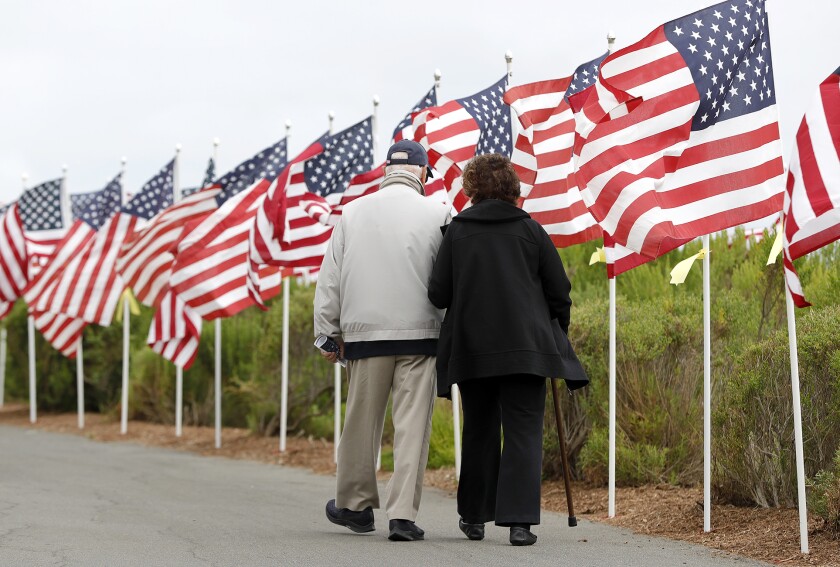 Veteran Bill Moodie and his wife, Helen, visit the Exchange Club of Newport Harbor's 13th annual Field of Honor.