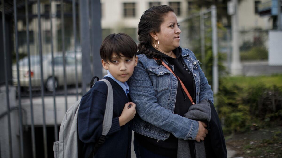 Angelica Valdovinos, 33, walks home with her son, Merwinn Rojas, 11, after school at Foshay Learning Center in Los Angeles.