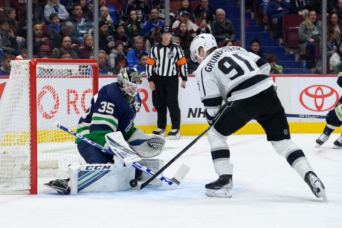Canucks goalie Thatcher Demko saves a second-period shot by the Kings' Carl Grundstrom on Nov. 18, 2022.