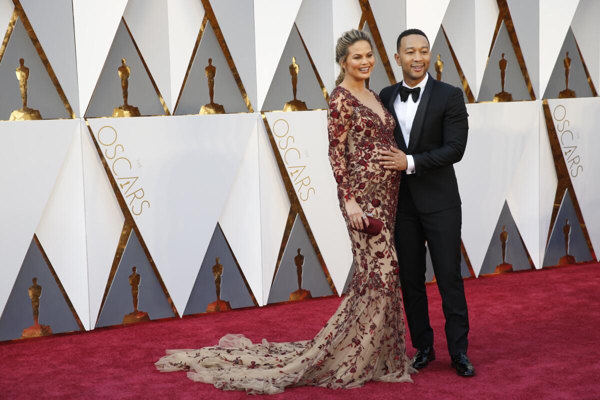 John Legend & Chrissy Teigen during the arrivals at the 88th Academy Awards.