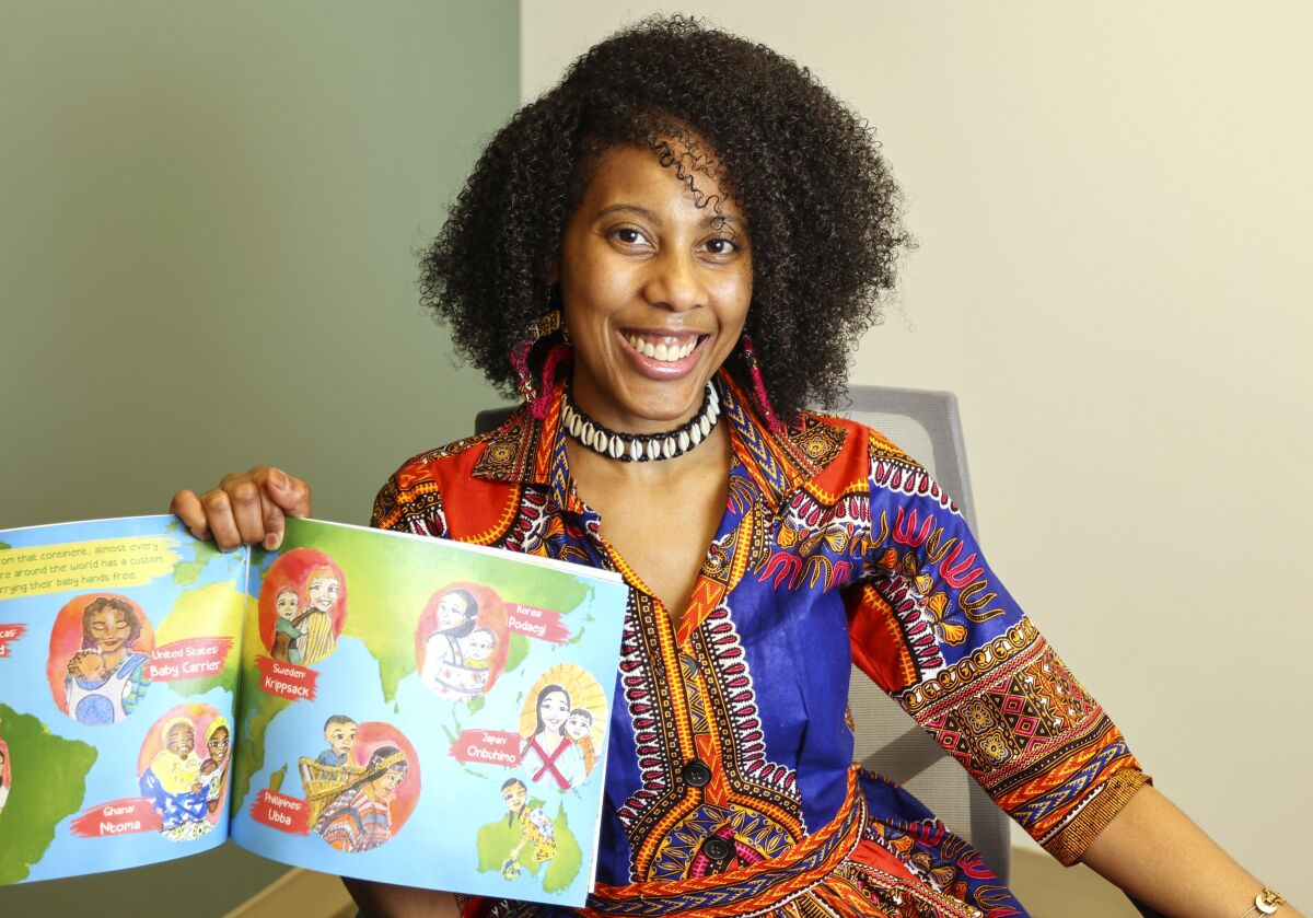 Local author Annette McKinney with a copy of her children's book