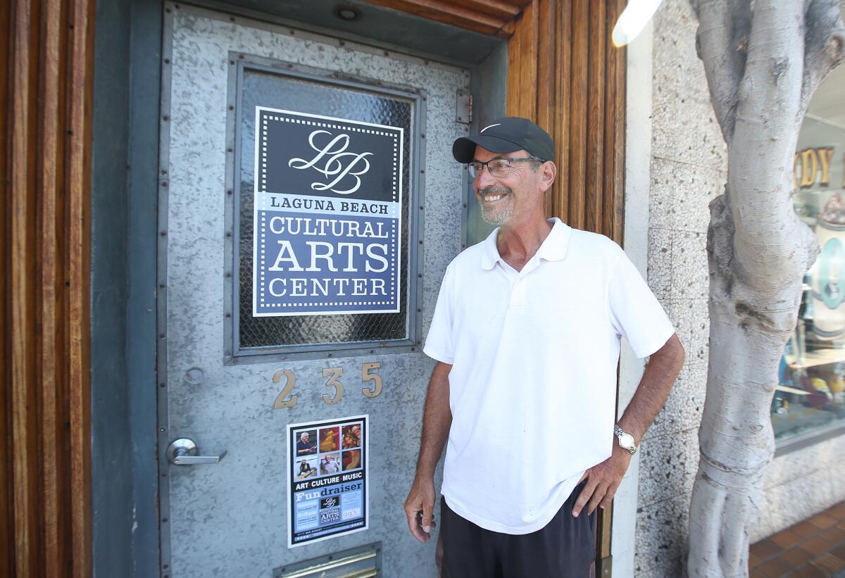 Founder Rick Conkey stands next to the Laguna Beach Cultural Arts Center sign at the old BC Space Gallery at 235 Forest Ave. in downtown Laguna Beach. The organization is holding a fundraiser Saturday to help with building renovations.