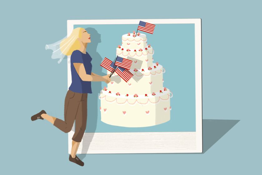 A woman with a bridal veil and small American flags stands in front of a picture of a wedding cake topped with another flag.