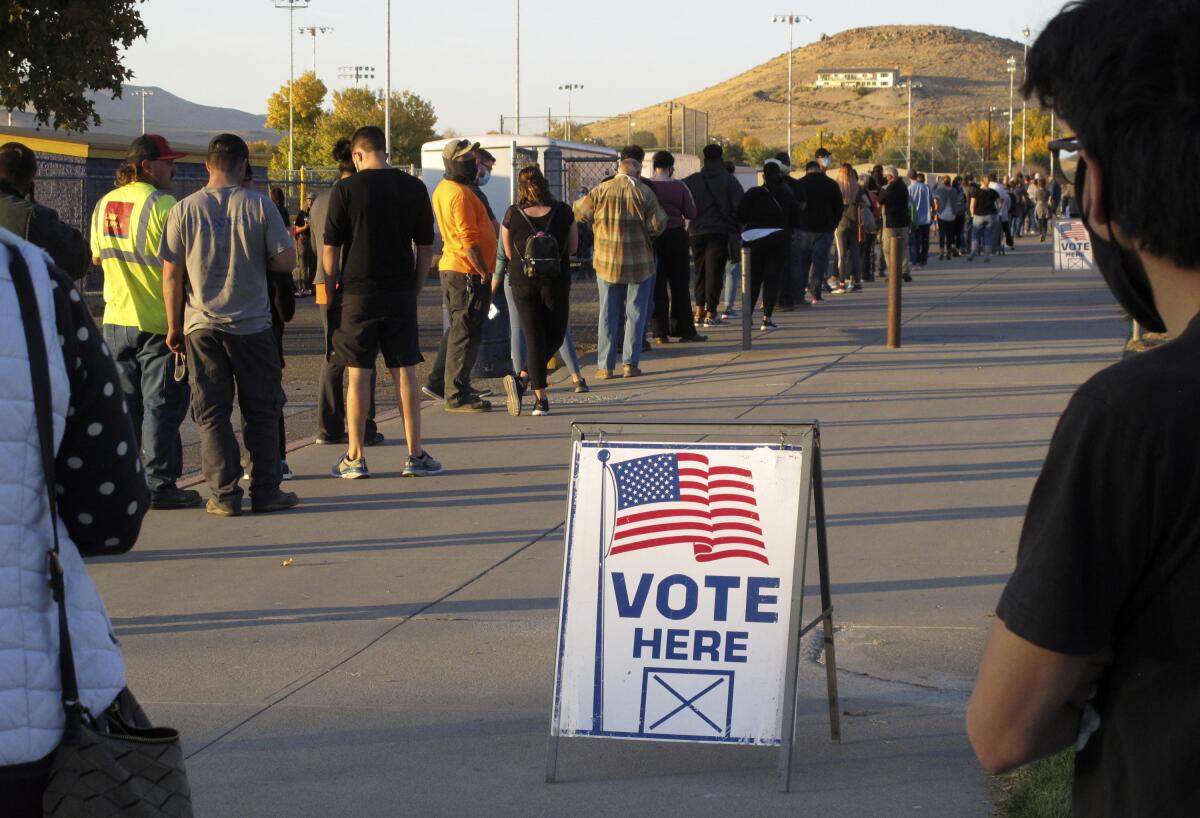  Nevadans wait in line to vote in 2020 