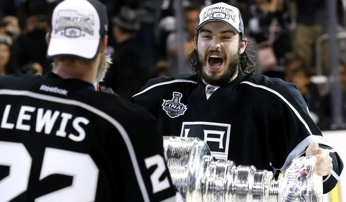 Defenseman Drew Doughty takes his turn with the Stanley Cup after the Kings secured their second NHL title in three years with a win over the New York Rangers on Friday night at Staples Center.