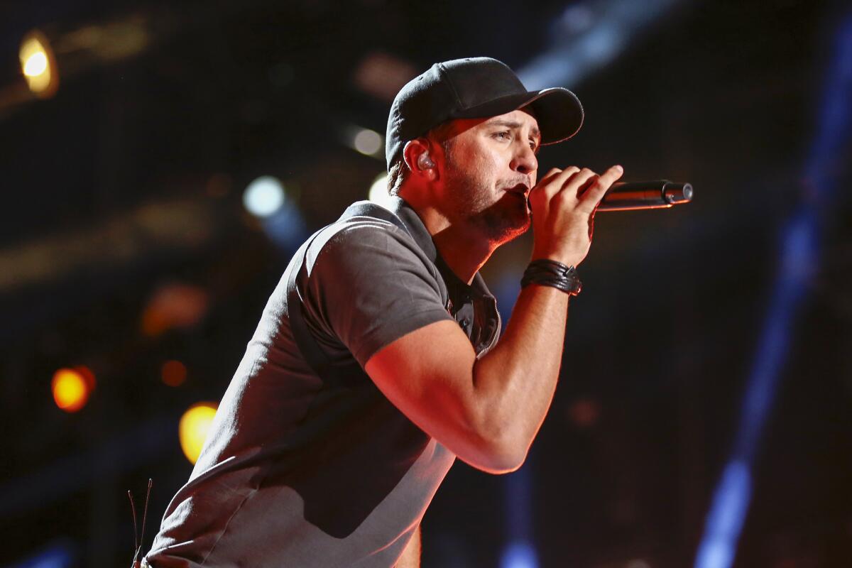 Luke Bryan, seen performing in June, has a new album, "Kill the Lights."