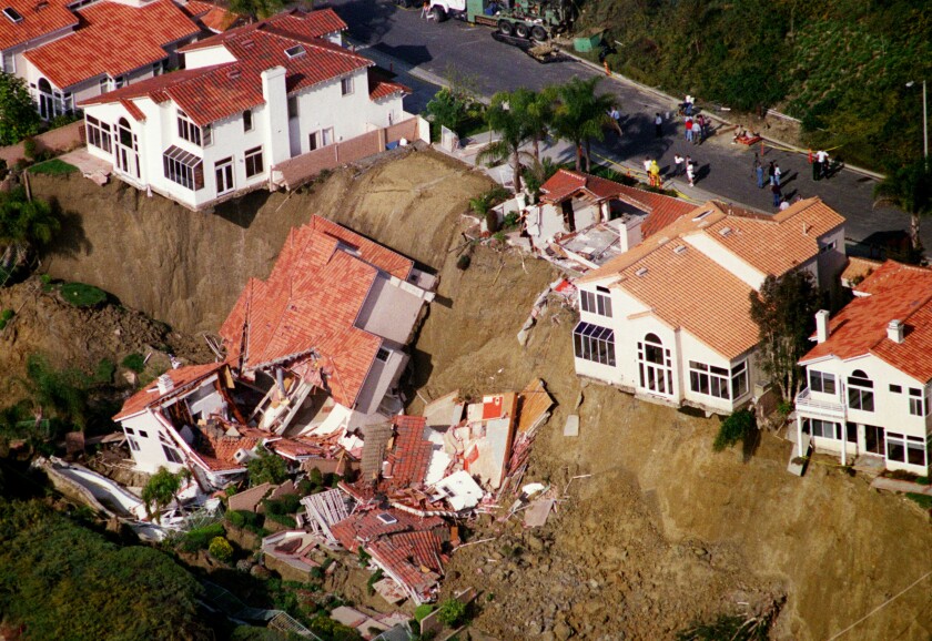 An aerial photo of two houses in Laguna Niguel that collapsed down a hillside.