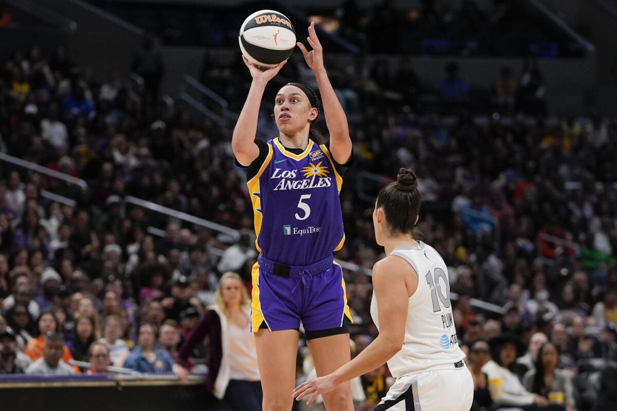 Sparks forward Dearica Hamby shoots in front of Las Vegas Aces guard Kelsey Plum on June 9
