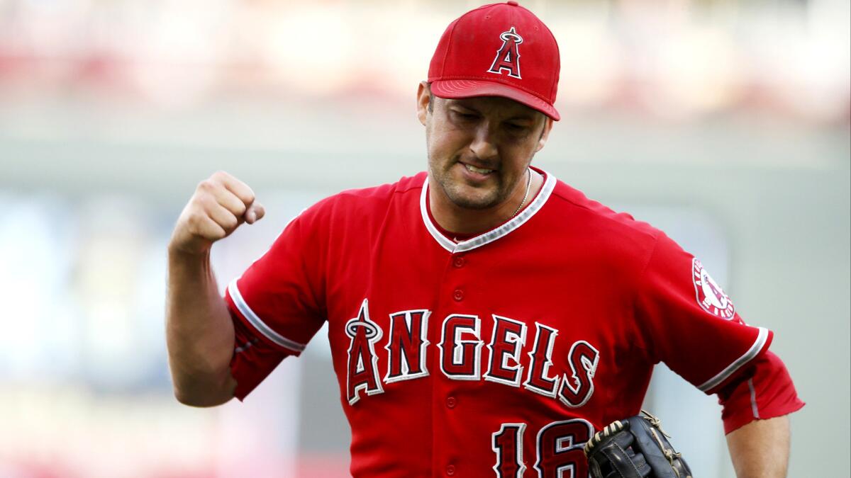 Angels closer Huston Street reacts after recording the final out in Game 1 of a doubleheader against the Twins on Saturday in Minneapolis.