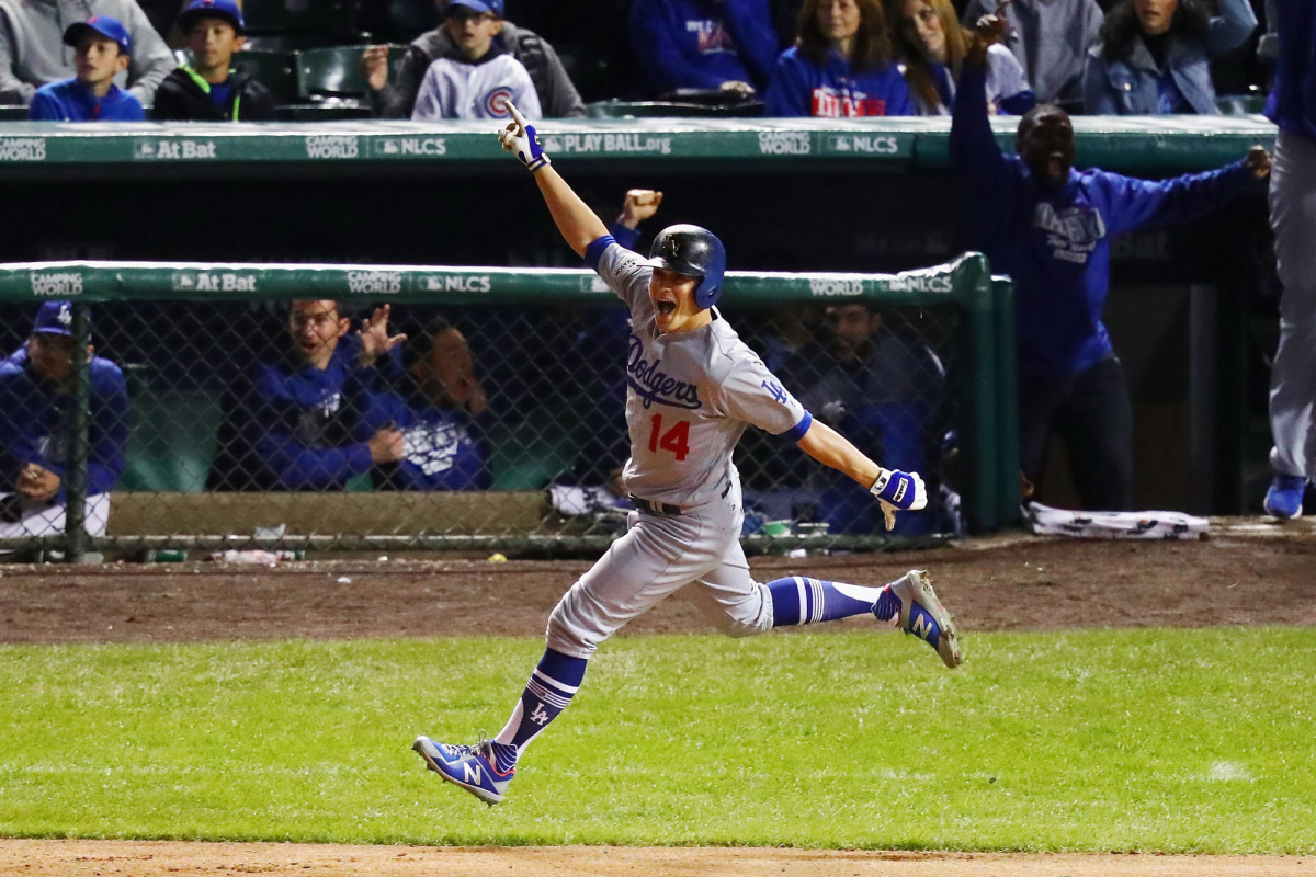 Kiké Hernández celebrates after hitting a two-run home run in the ninth inning against the Chicago Cubs.