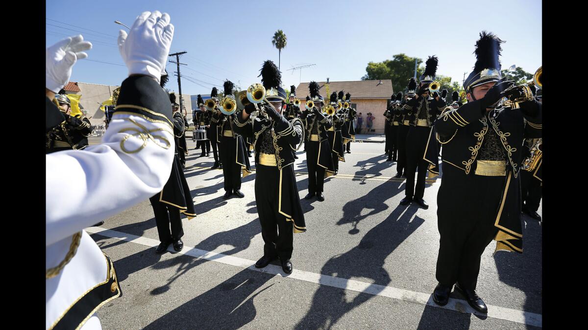 Members of the San Pedro High School Golden Pirate Regiment perform in a Labor Day parade in Wilmington.
