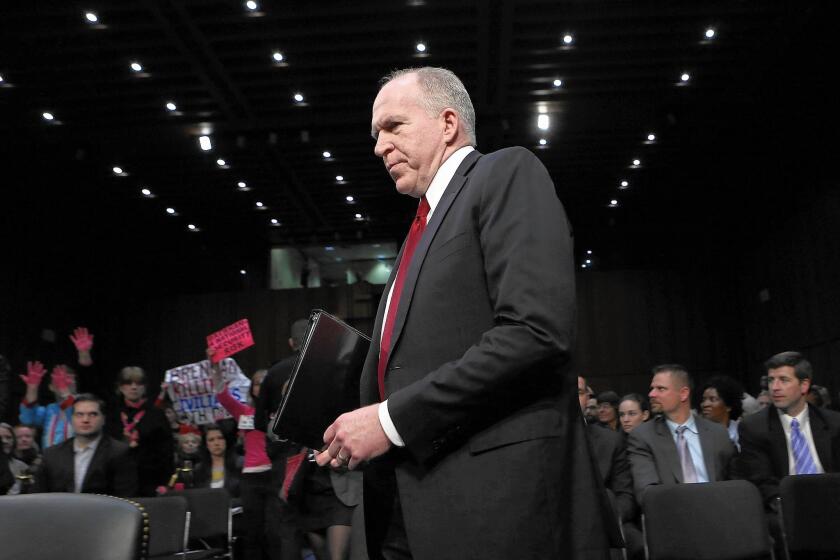 The White House continues to support CIA Director John Brennan, shown at a Senate hearing last year, who was the agency’s deputy executive director in 2002 when the interrogation program was designed and implemented.