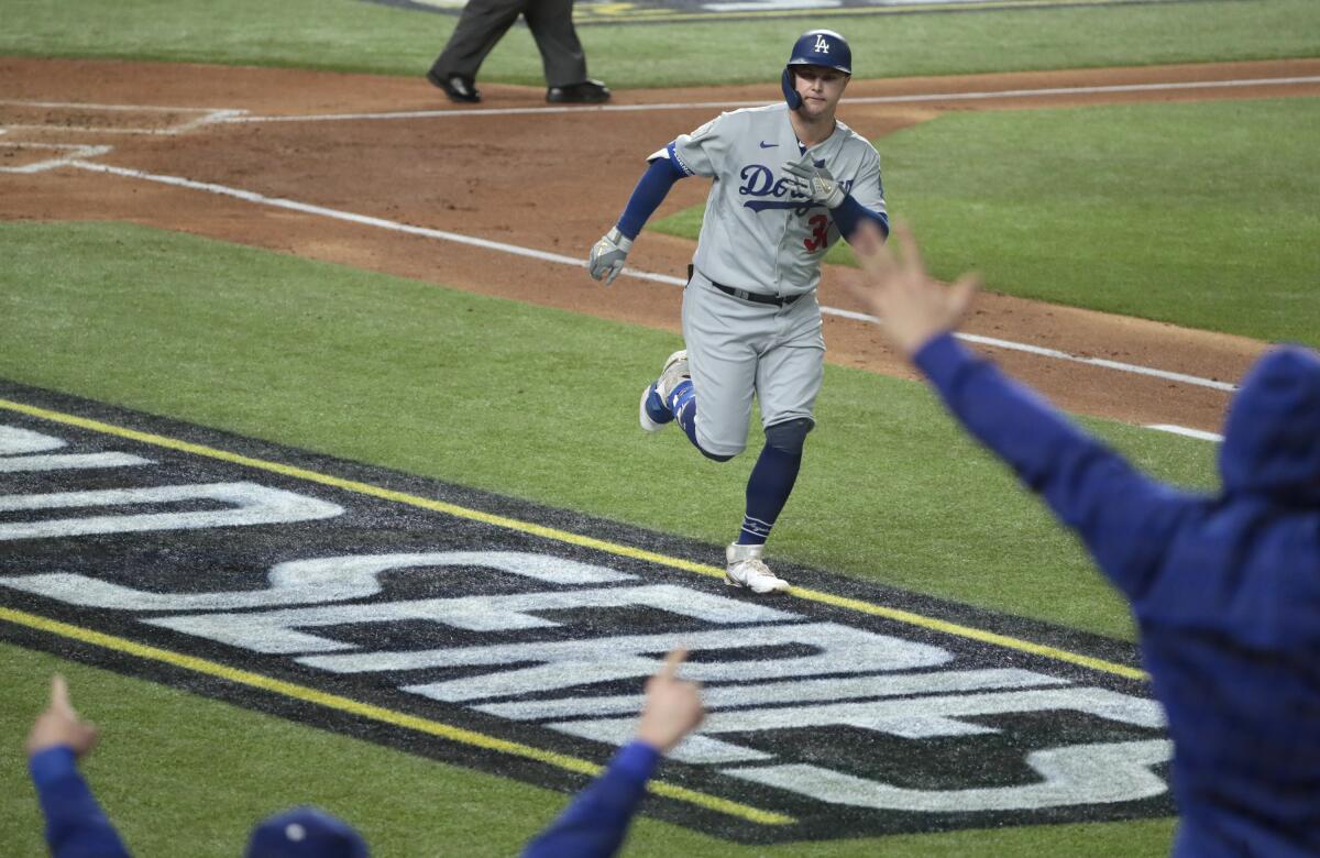 Dodgers left fielder Joc Pederson celebrates after hitting a home run against the Tampa Bay Rays.