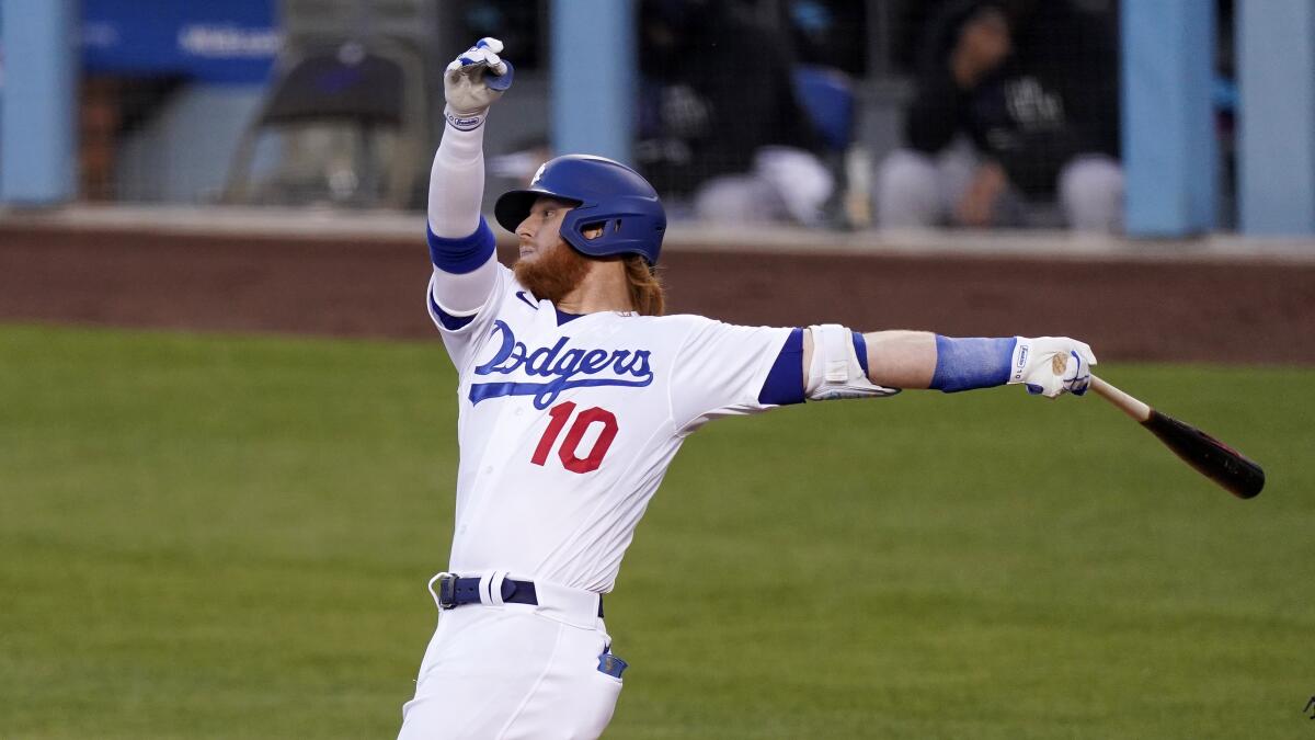 Dodgers third baseman Justin Turner bats against the Miami Marlins on Friday.