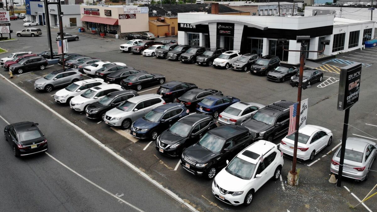 New vehicles are displayed for sale at a Buick GMC dealership in Union, N.J. Sales of new vehicles in the U.S. during 2018 exceeeded expectations.