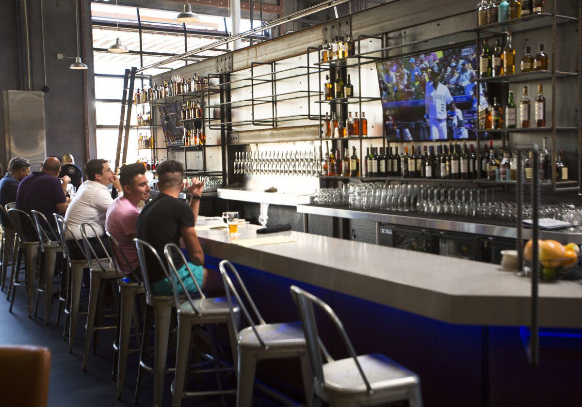 The new Urge Gastropub and Common House features 21,000-square-feet of space which houses a Mason Ale Works brewery, restaurant, three bars, an 8-lane bowling alley and a large patio with bocce ball courts, and oversize table games. (Howard Lipin/San Diego Union-Tribune)