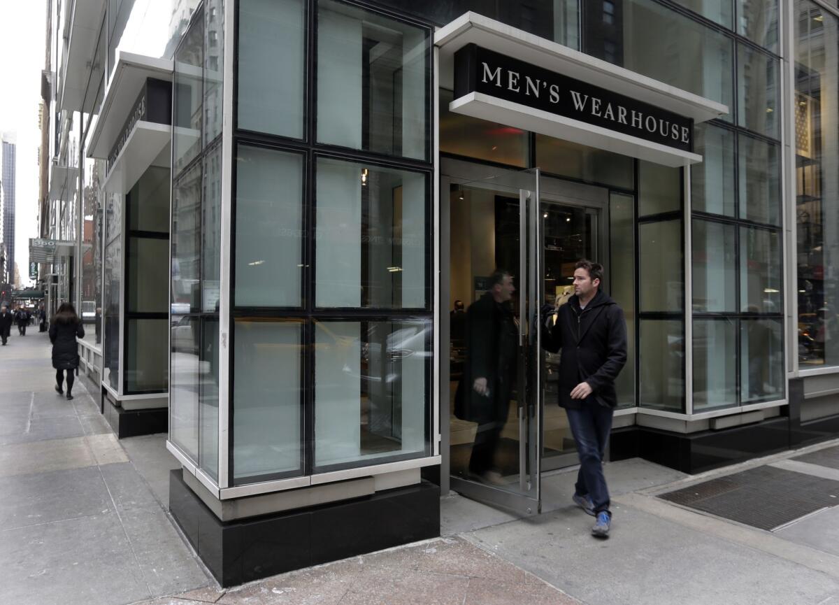 After a long takeover battle, Men's Wearhouse said Tuesday it would buy rival Jos. A. Bank in a deal valued at $1.8 billion. Above, a Men's Wearhouse store in New York.