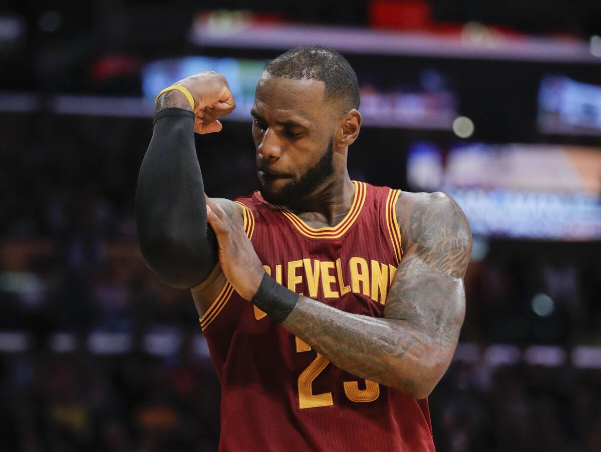 Cleveland Cavaliers' LeBron James flexes his arm after making a basket and drawing a foul call against the Los Angeles Lakers during the second half of an NBA basketball game in Los Angeles. The superstar declined his $35.6 million contract option on Friday, June 29, 2018, with Cleveland and will become a free agent. The four-time MVP could re-sign with his hometown Cavaliers, or go in a completely direction. What he decides in the next few days could re-shape the NBA landscape.