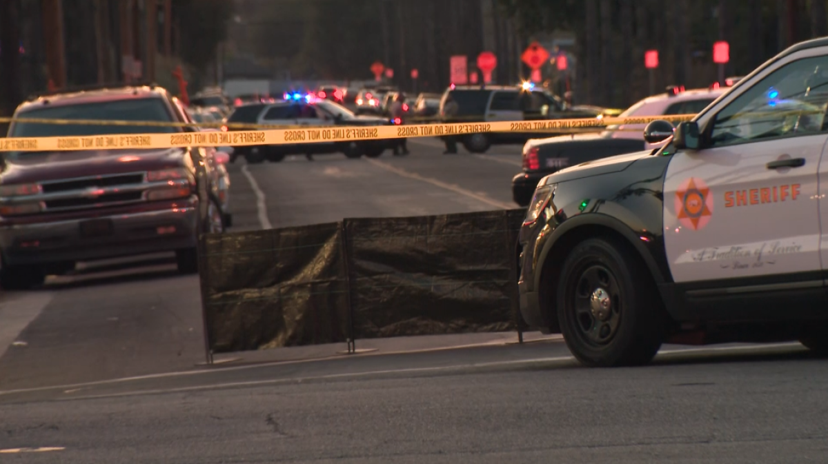 Law enforcement vehicles are on the scene after L.A. County sheriff’s deputies fatally shoot a suspect in Altadena Sunday.