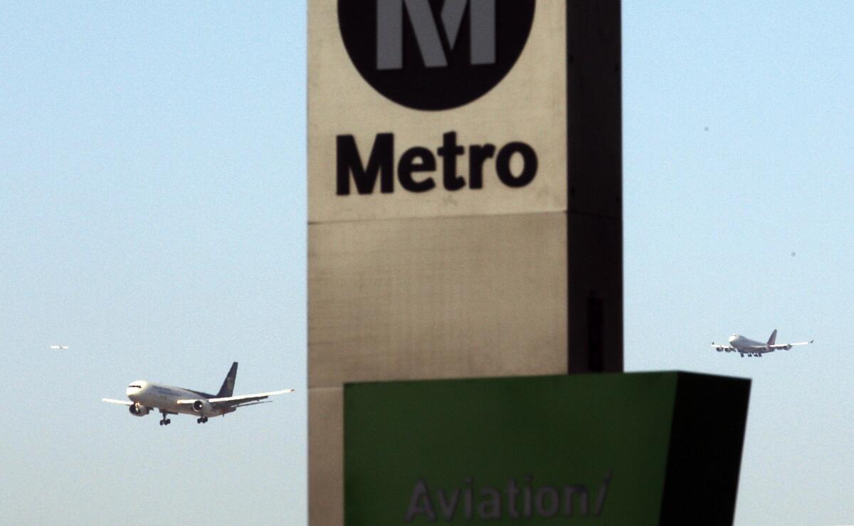 The Metro Green Line station at Aviation Boulevard and Imperial Highway serves passengers using public transportation to and from Los Angeles International Airport. They board a shuttle bus to terminals, which are about two miles away.