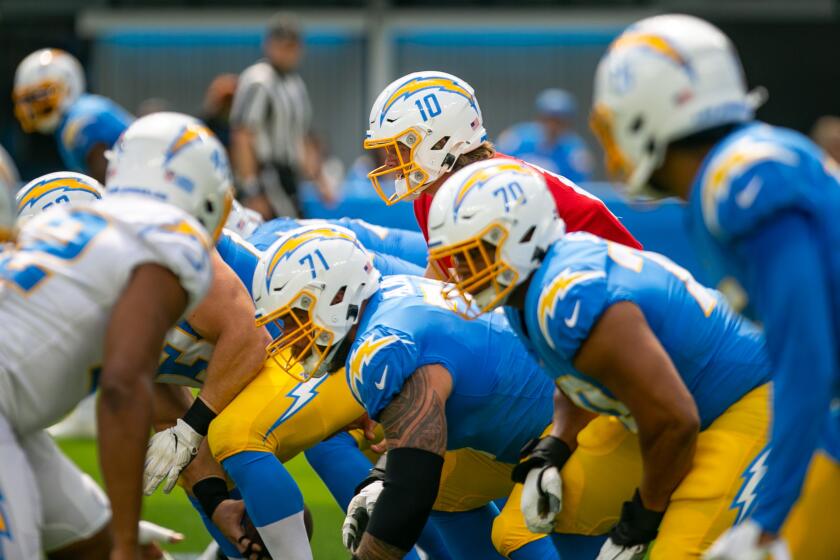 PLAYA DEL REY, CA - AUGUST 08: Los Angeles Chargers quarterback Justin Herbert (10) lines up for a snap.