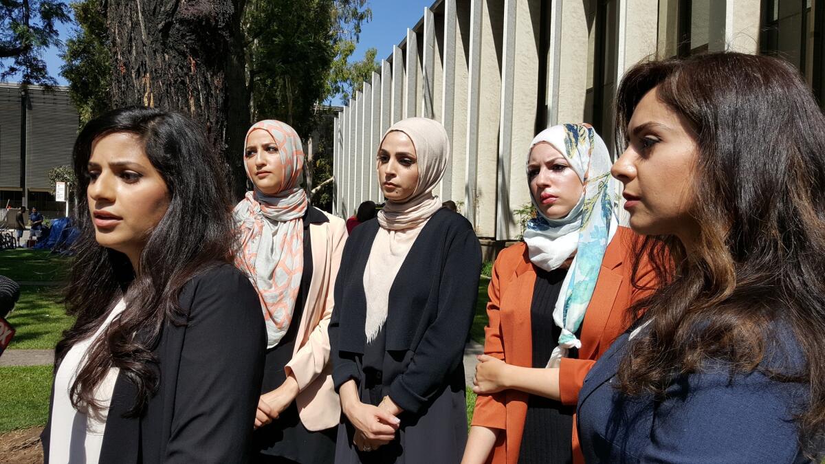 Sara Farsakh, 29, left, with three other plaintiffs and one of their lawyers, who sued Urth Caffe in Laguna Beach for discrimination, alleging they were targeted in 2016 for being "visibly Muslim."