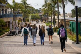 San Diego, California - March 11: Campus life at Point Loma Nazarene University. Students walking in the middle of campus in Point Loma on Monday, March 11, 2024 in San Diego, California. (Alejandro Tamayo / The San Diego Union-Tribune)
