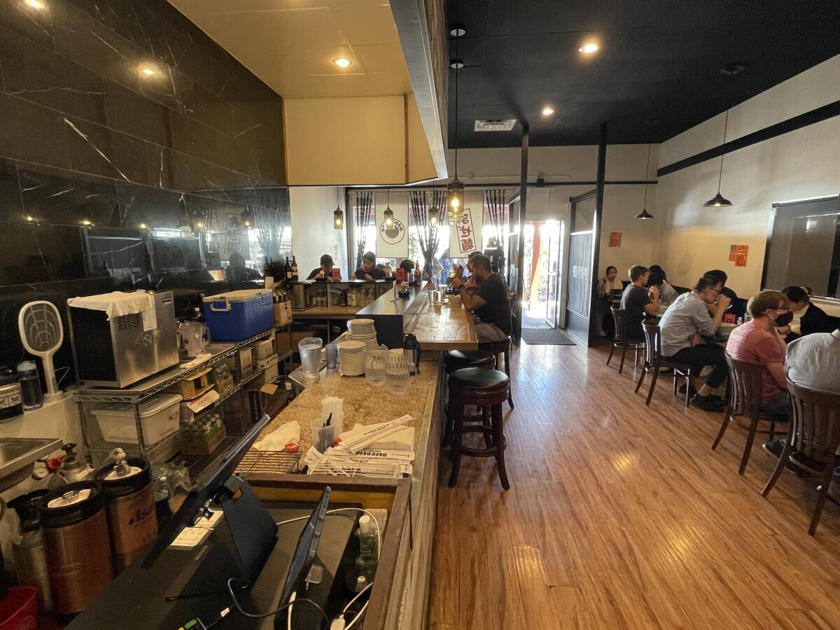 Diners try the ramen and specialties at Mogumogu on Fairview Road in Costa Mesa.