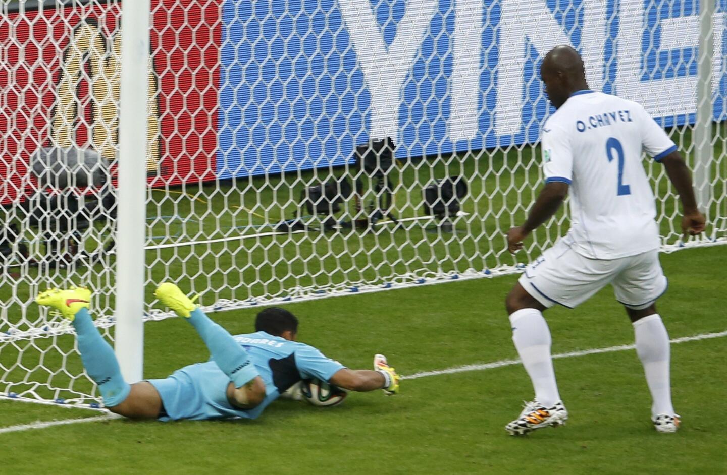 Valladares of Honduras fumbles the ball, which resulted in a goal, during their 2014 World Cup Group E soccer match against France at the Beira Rio stadium in Porto Alegre