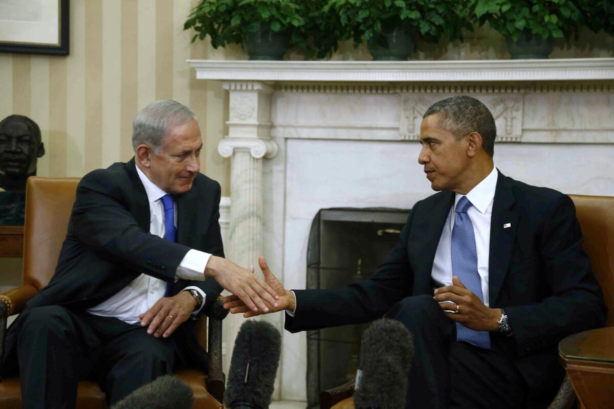 President Obama shakes hands with Israeli Prime Minister Benjamin Netanyahu during their meeting in the Oval Office of the White House in Washington on Monday.