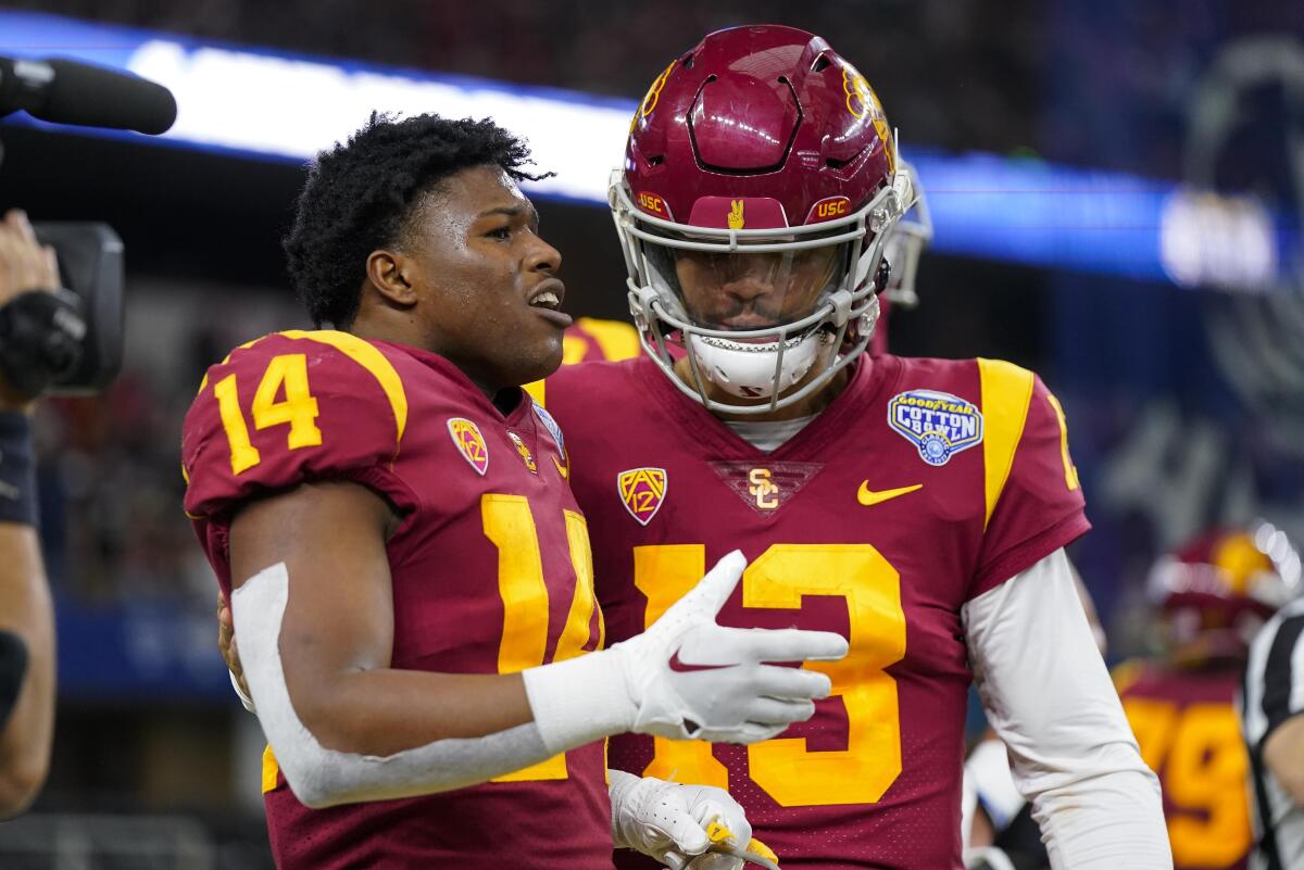USC running back Raleek Brown, left, is congratulated by quarterback Caleb Williams after scoring a touchdown