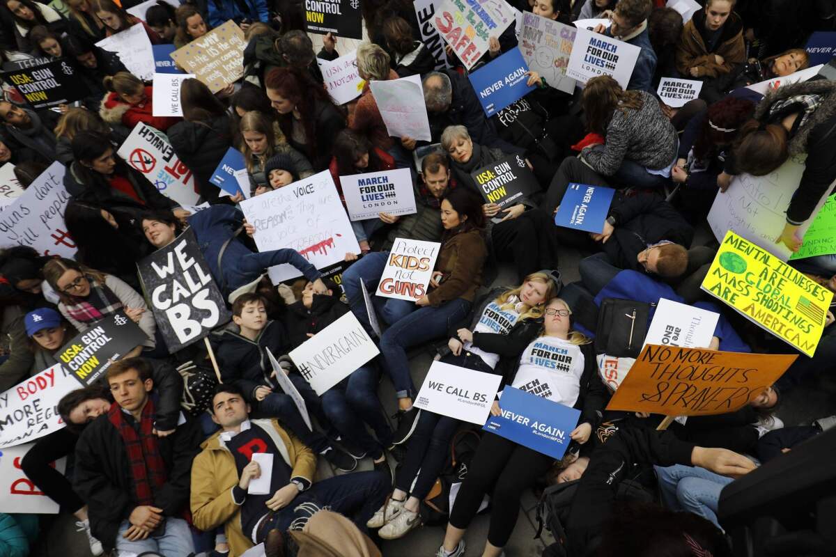 LONDON: Protesters stage a "die-in" outside the U.S. Embassy during the March for Our Lives in London.