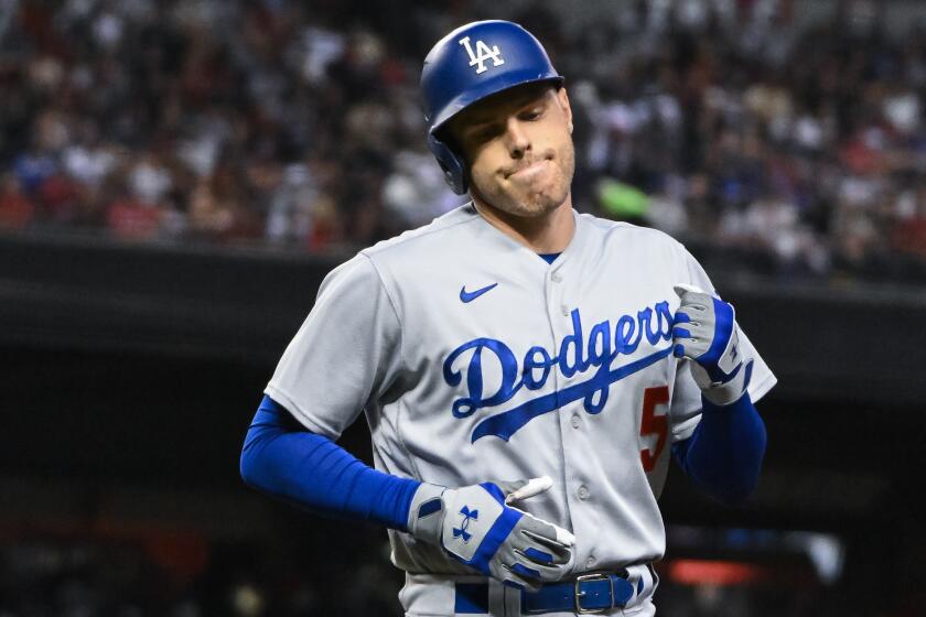 PHOENIX, AZ - October 11: Los Angeles Dodgers Freddie Freeman react to being out during game.