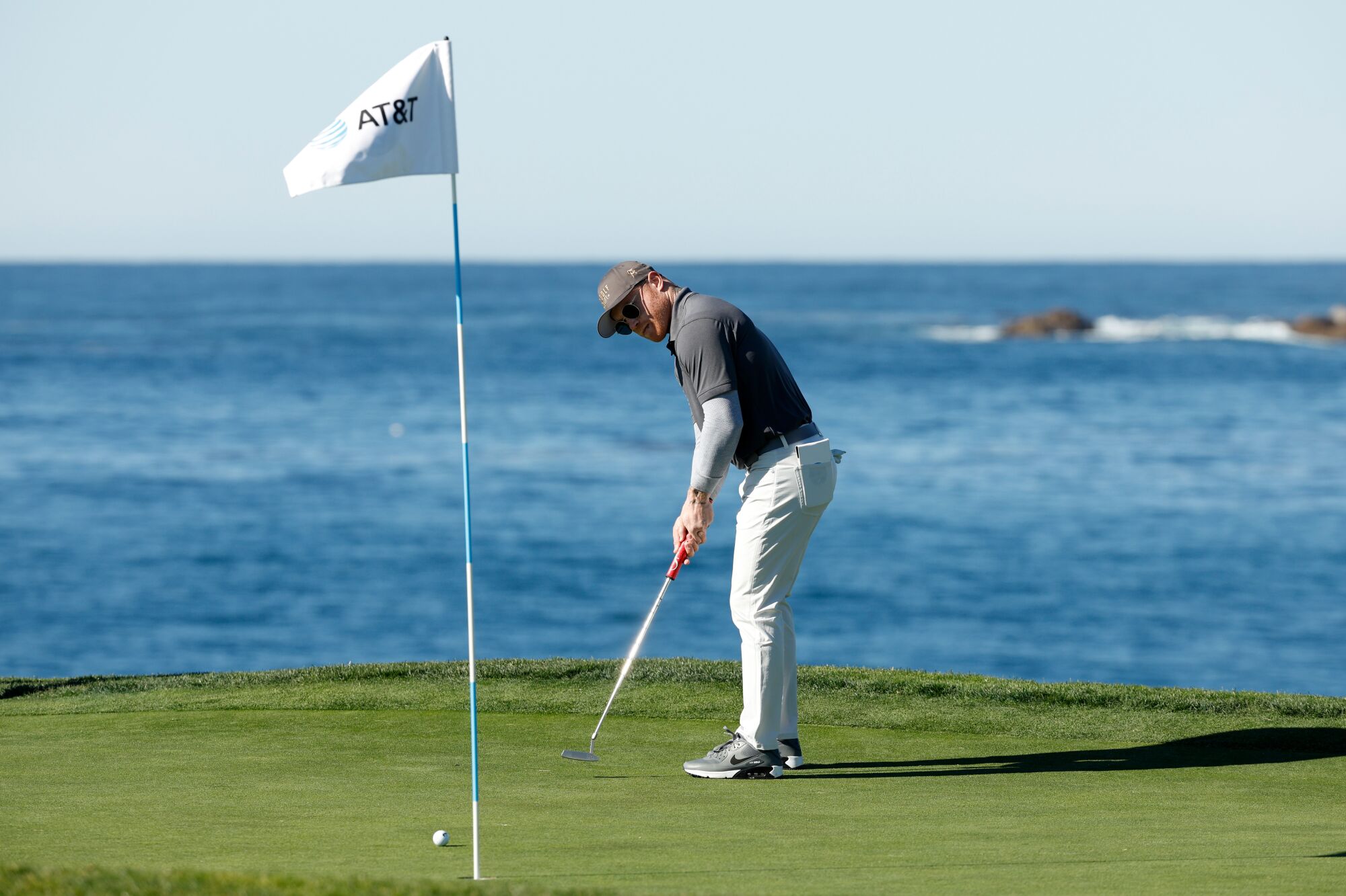 Saul "Canelo" Álvarez putts on the seventh green during a Pebble Beach Pro-Am practice round at Pebble Beach Golf Links.