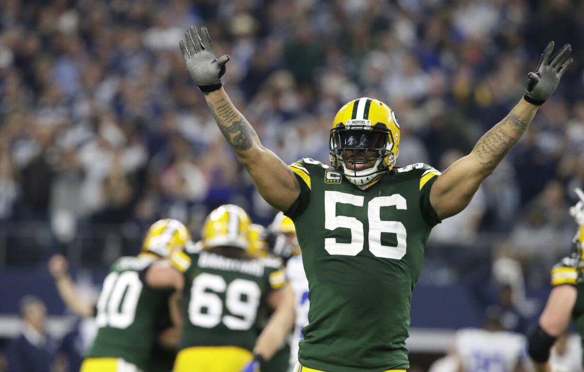 Packers outside linebacker Julius Peppers (56) celebrates after winning a divisional playoff football game against the Dallas Cowboys on Jan. 15.