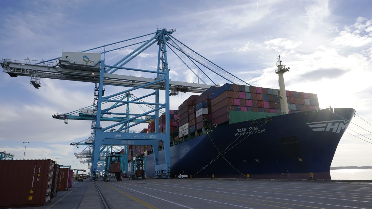 The container ship Hyundai Hope sits pier side as it is loaded at the Norfolk International Terminal Wednesday Dec 1, 2021, in Norfolk, Va. The U.S. trade deficit soared to a record $859.1 billion last year, Tuesday, Feb. 8, 2022, as American consumers splurged on foreign-made electronics, toys and clothing, fallout from the economy’s unexpectedly robust recovery from a short but nasty 2020 pandemic recession. (AP Photo/Steve Helber)